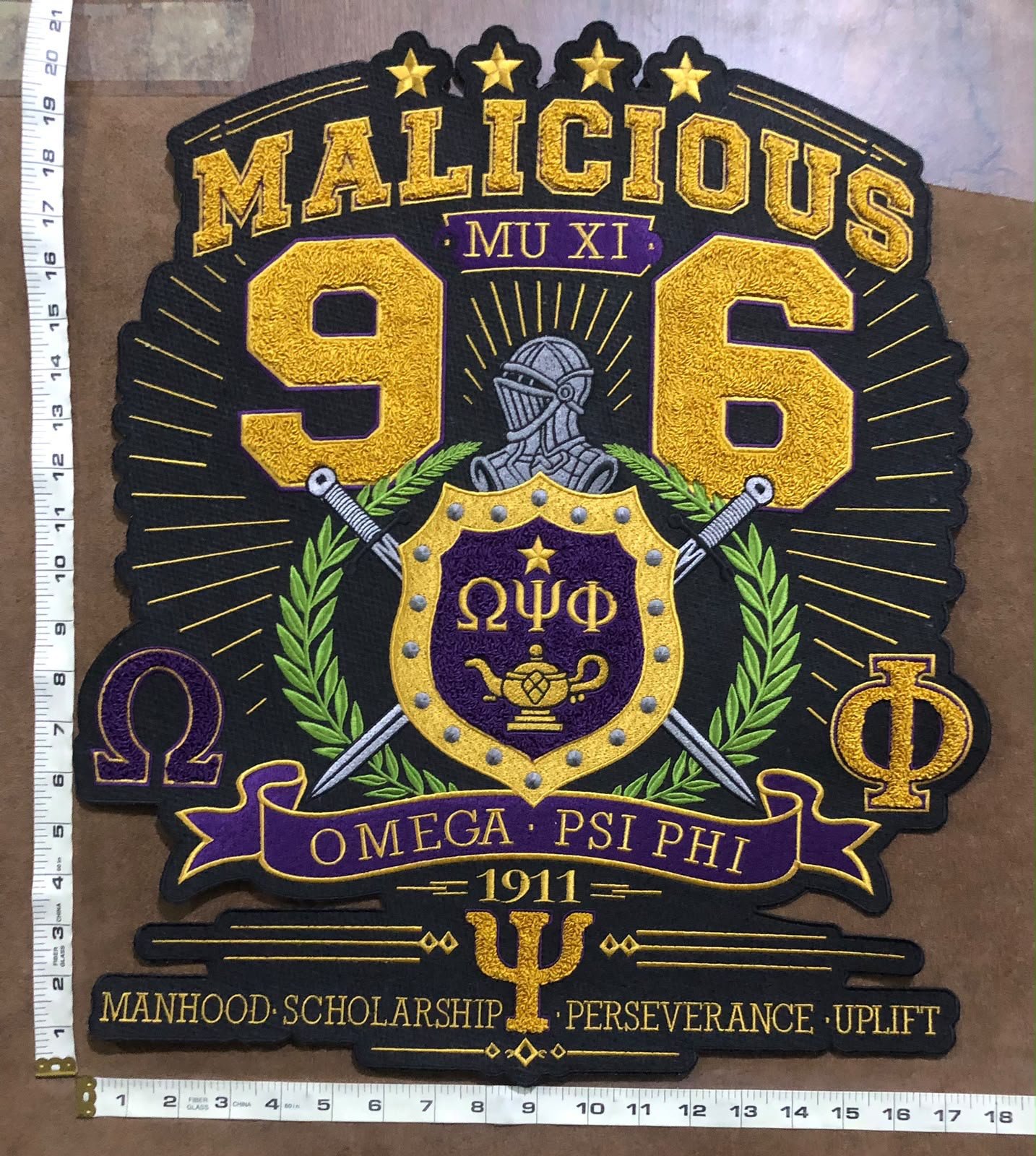 finished embroidered Omega Psi Phi patch on varsity jacket